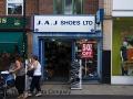 J a J Shoes logo