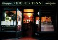 Riddle & Finns Champagne and Oyster Bar logo