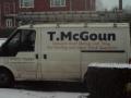 T.McGoun Roofing contractors logo
