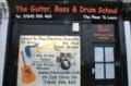 The Guitar, Bass & Drum School logo
