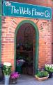 The Wells Flower Company logo