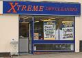 Xtreme Dry Cleaners logo