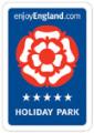 The Old Mill Holiday Park logo