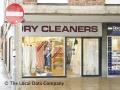 Excel Dry Cleaners logo