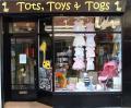 Tots Toys and Togs logo