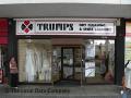 Trumps Dry Cleaning logo