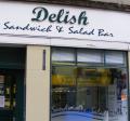 Delish Sandwich and Salad Bar logo