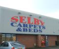 Selby Carpets logo